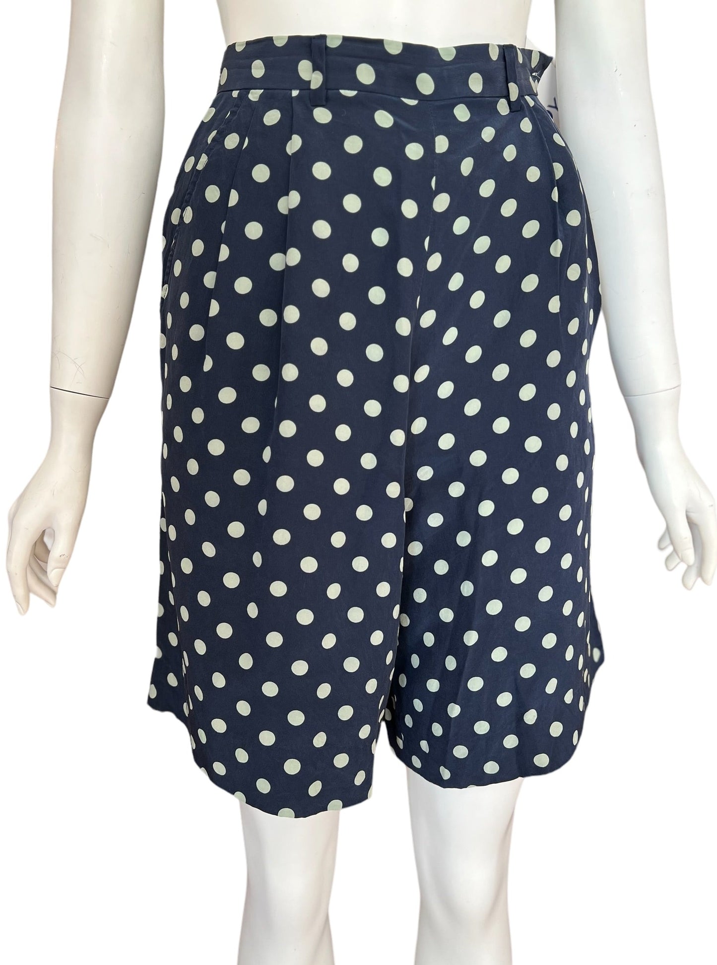 High waist, mid-length vintage silk shorts by ralph lauren.  Classic cut and polka dot print with button up closure on the side.