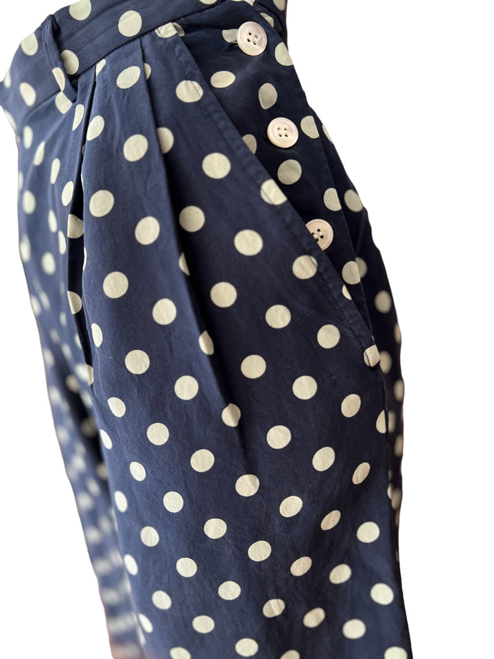 High waist, mid-length vintage silk shorts by ralph lauren.  Classic cut and polka dot print with button up closure on the side.