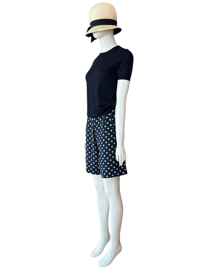 High waist, mid-length vintage silk shorts by ralph lauren.  Classic cut and polka dot print with button up closure on the side.