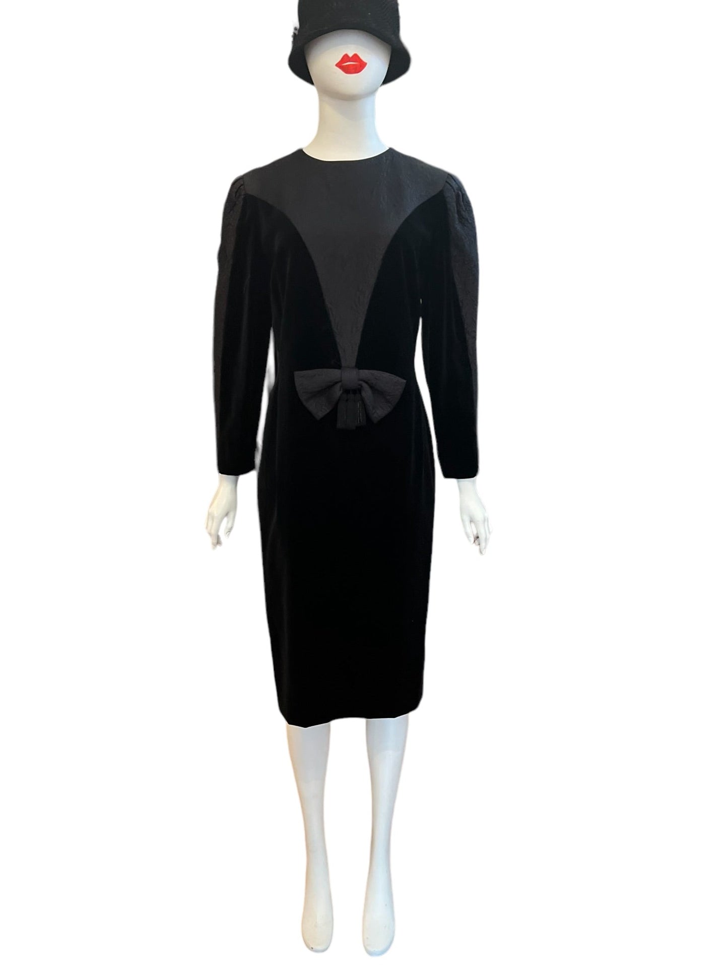 Louis Feraud velvet and contrasting textured material with a statement bow with tassels. 3/4 sleeve and midi length great for the holidays!